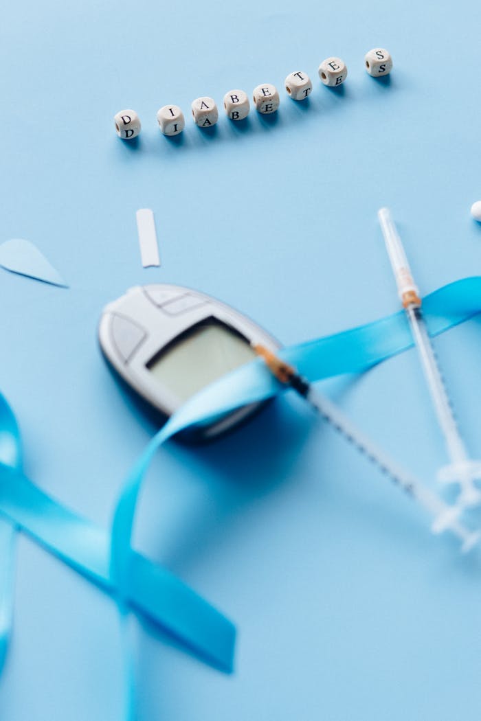 Blue ribbons and diabetes equipment highlight awareness and support.